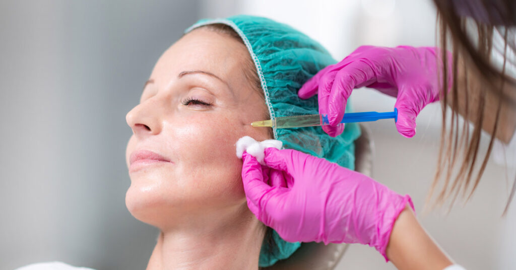 A woman is receiving a Juvederm® filler injection treatment